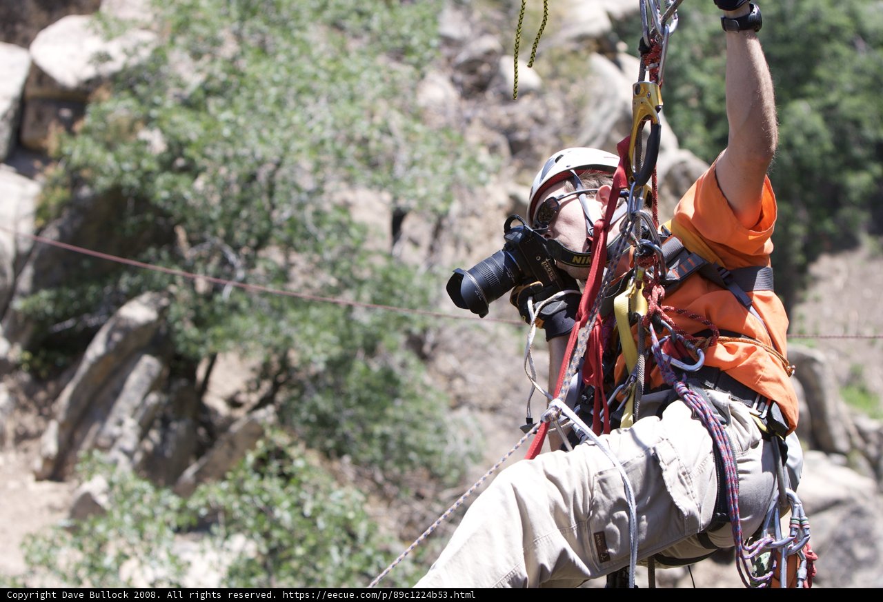 Capturing the Thrill Caption: A man on a zipline captures the rush of the outdoors with his camera during a highline training session in 2008.