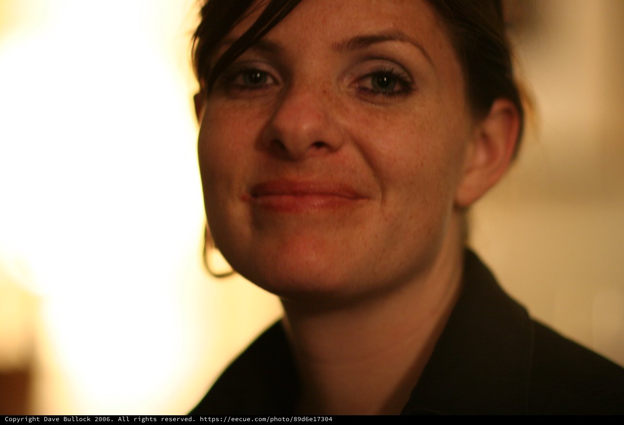Warm Candlelight Portrait of a Smiling Young Woman