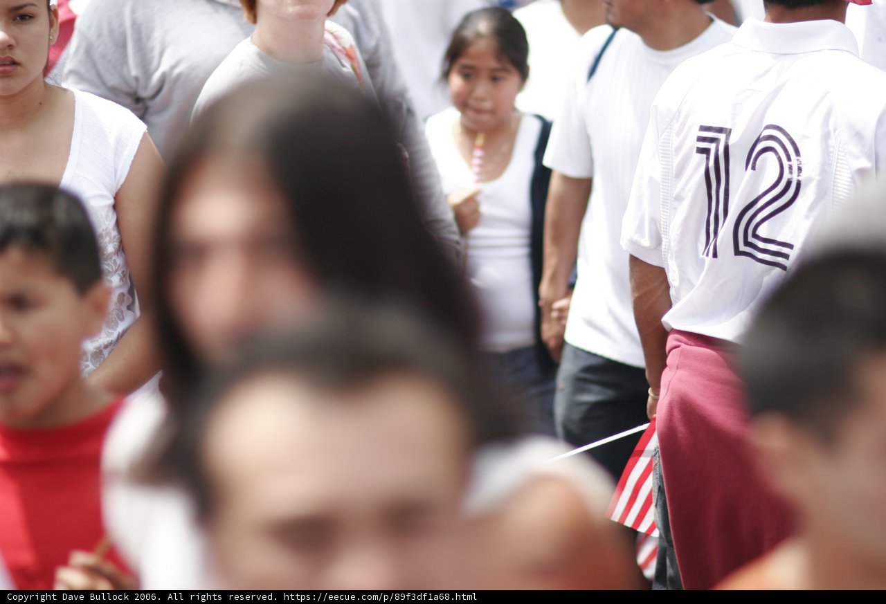 Crowd of People Wearing T-Shirts and Hats