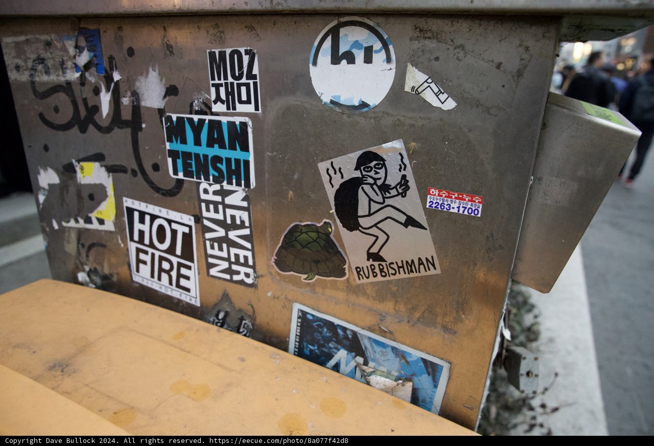 Urban Aspect: The Sticker Laden Trash Can