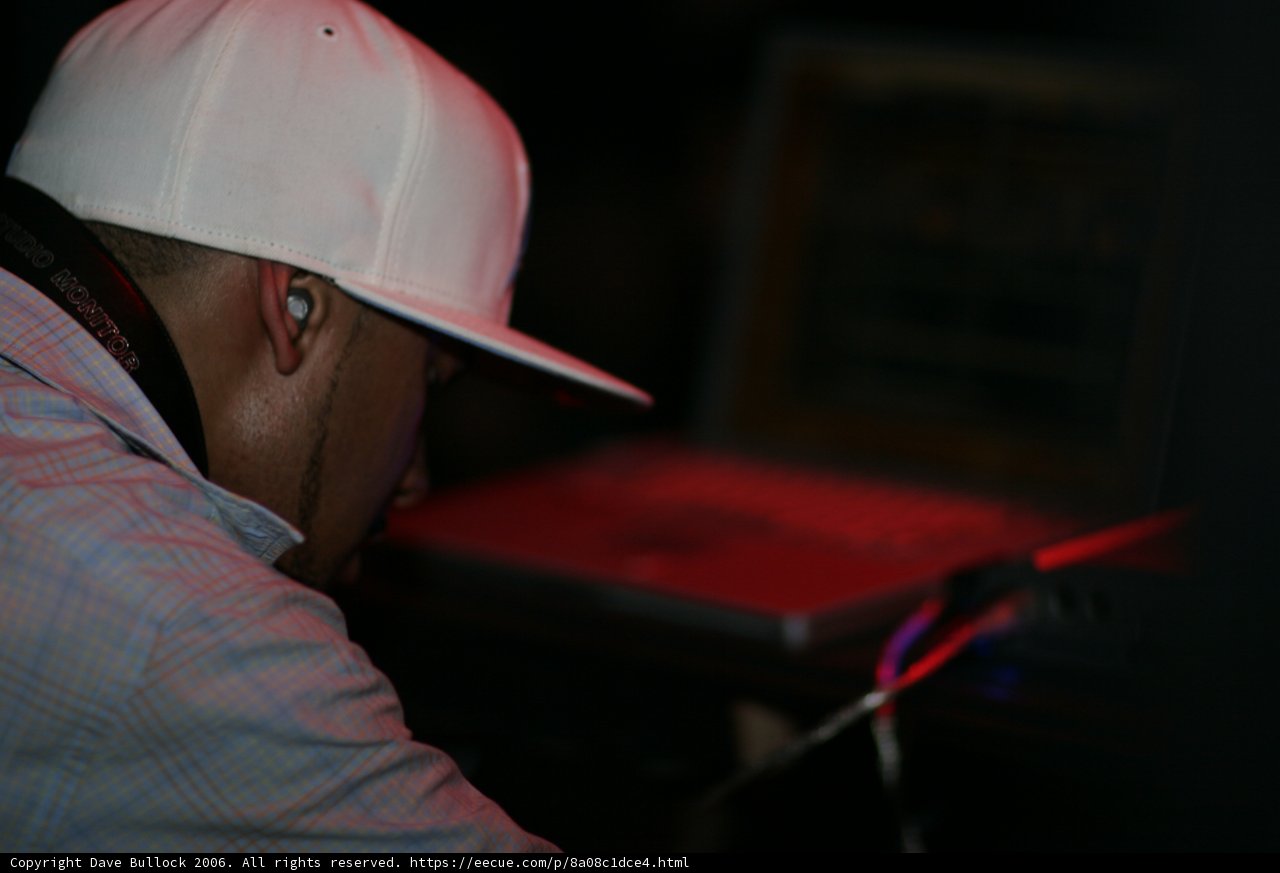 Man in White Hat Working on Laptop