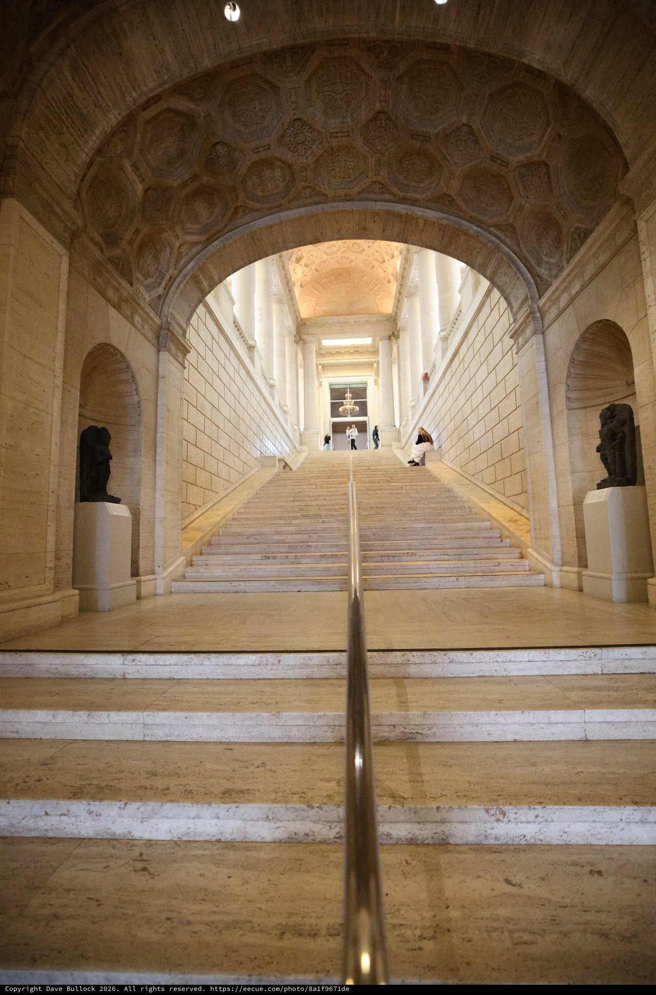 Grand Neoclassical Staircase Under Ornate Coffered Arch
