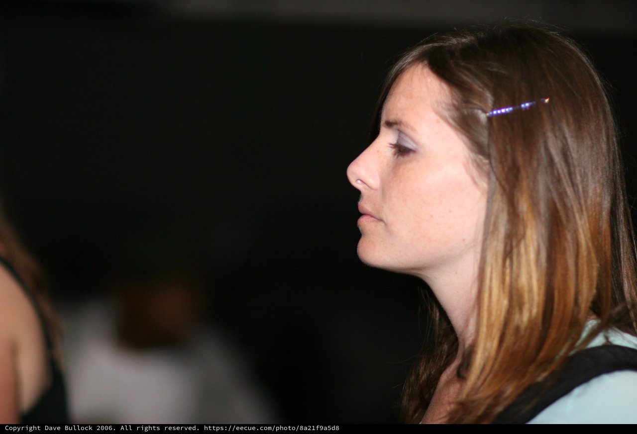 Profile Portrait of Woman in Dim Indoor Setting