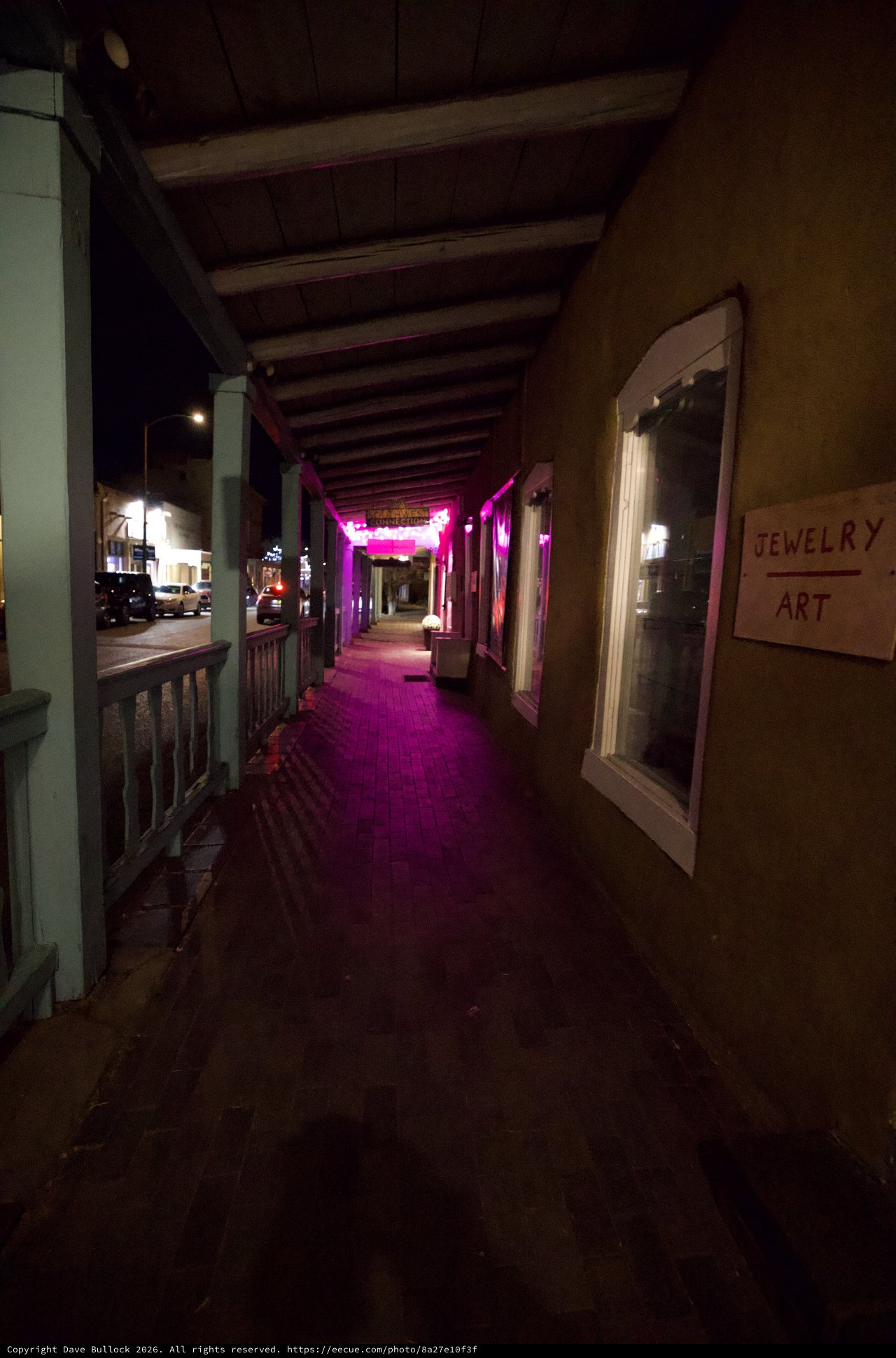 Pink Neon Lit Covered Walkway at Night