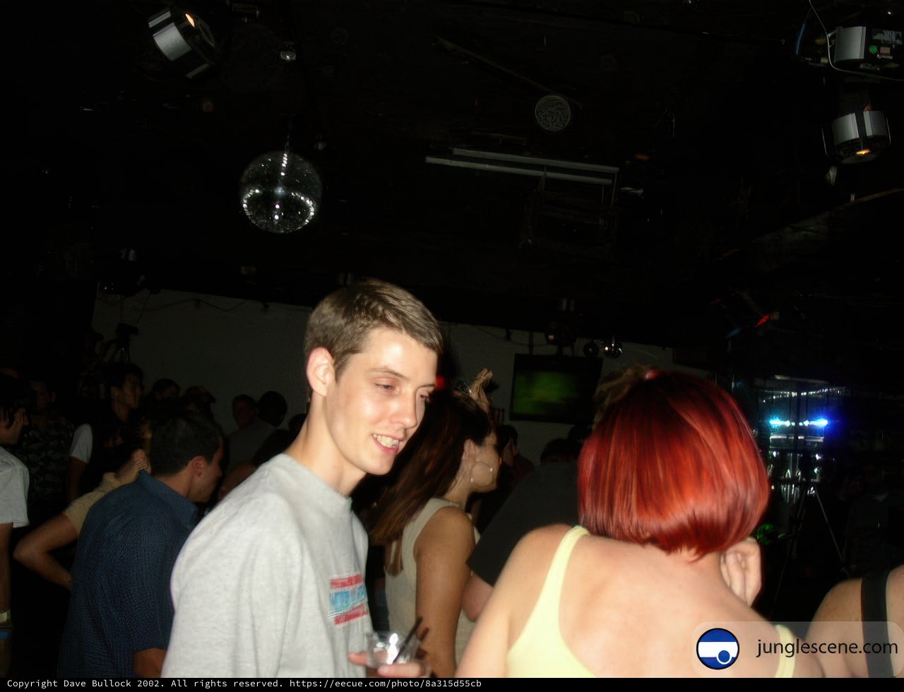 Red-Headed Club-goer in Front of a Crowd
