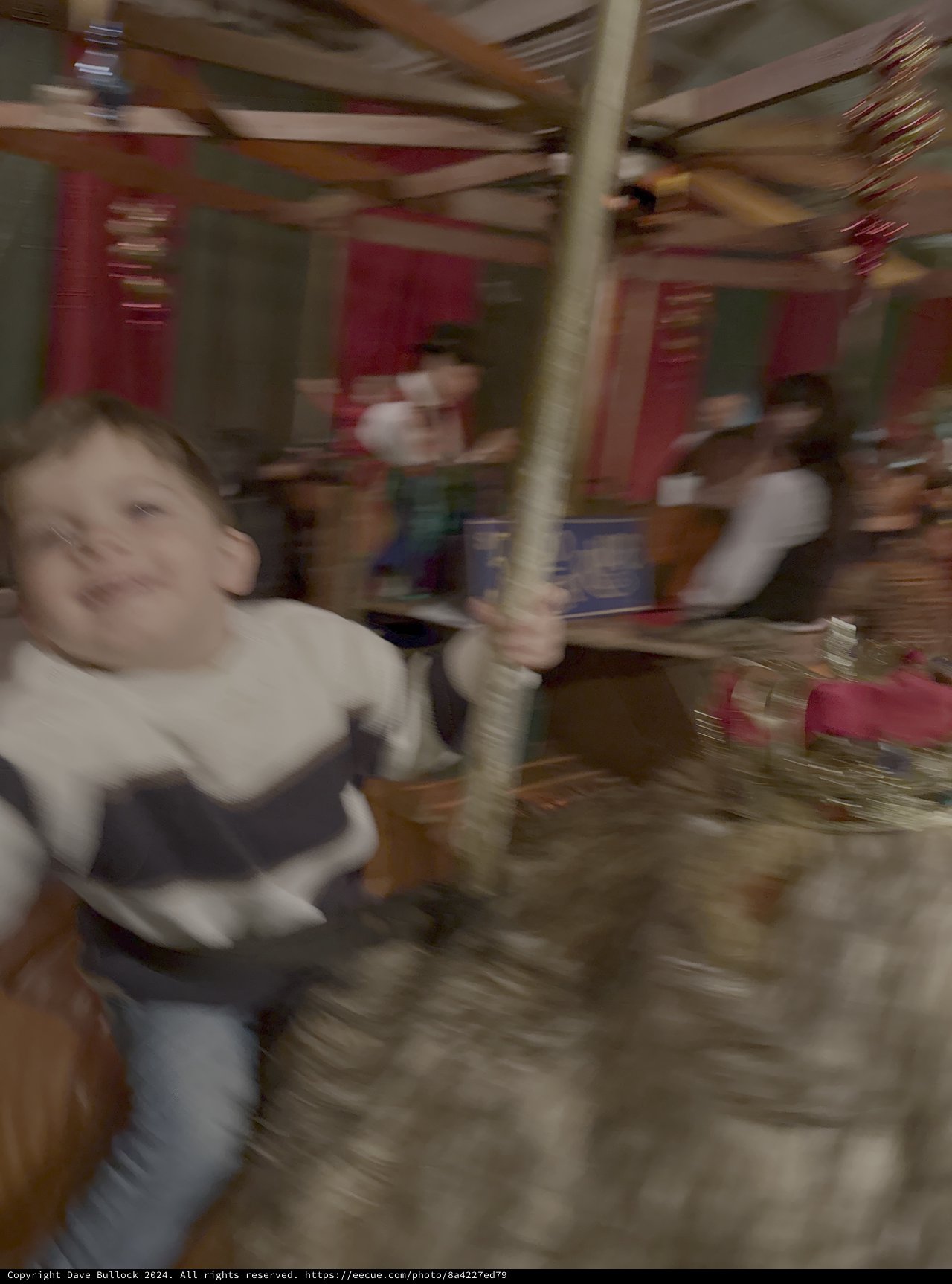 Joyful Child on Spinning Carousel Ride