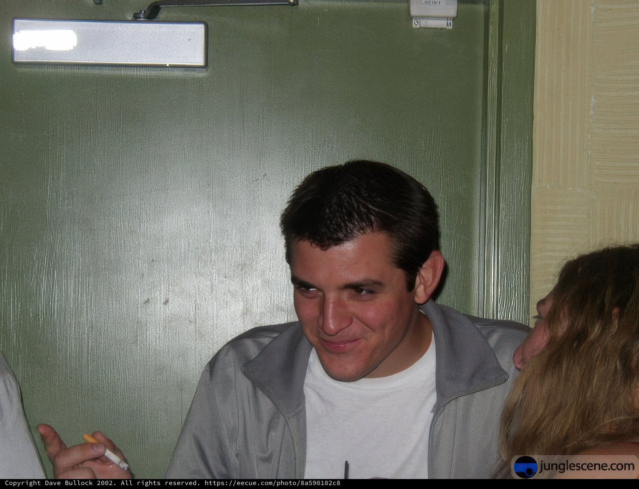 Smiling Man with Baby Indoors