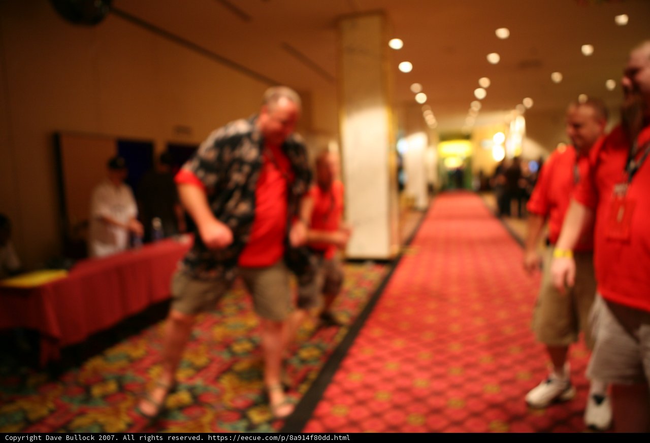 Fashionable Man in Red Shirt Walking on Outdoor Path