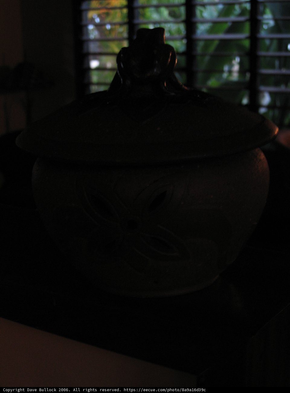 Silhouette of a Woman with a Pottery Pot