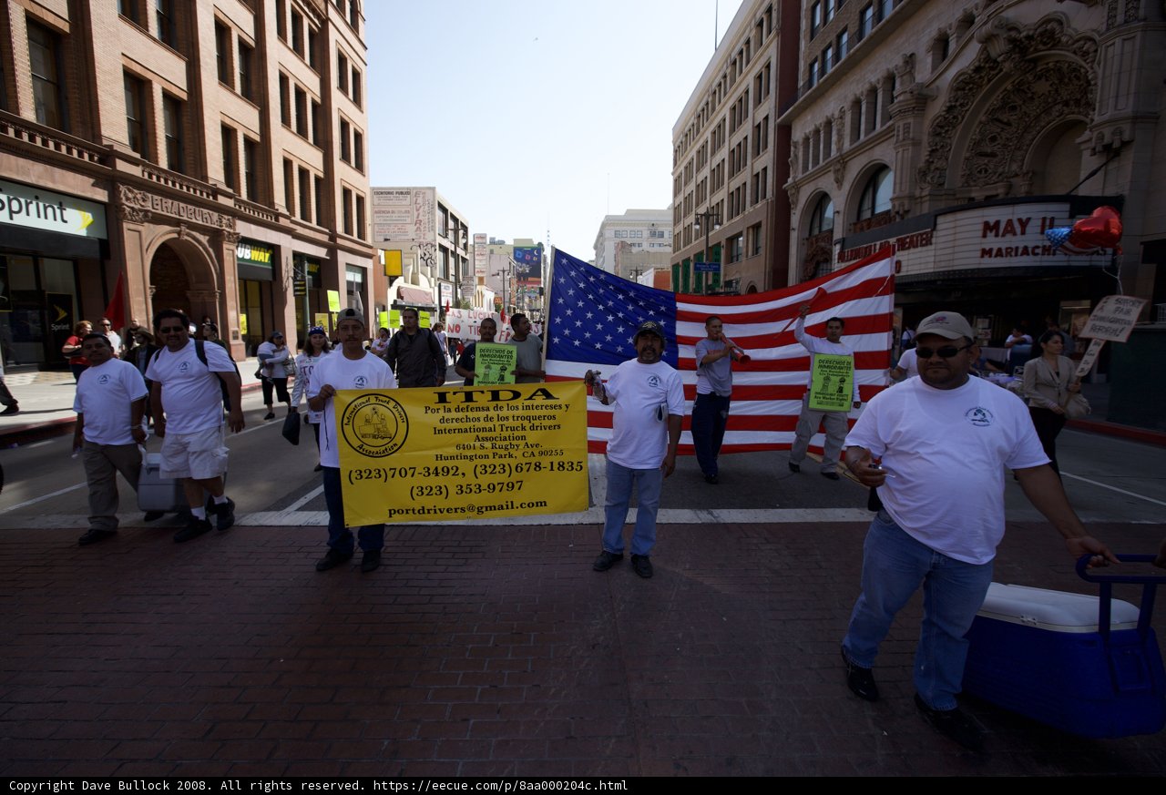Mayday Rally Walkers Carry Flag through City