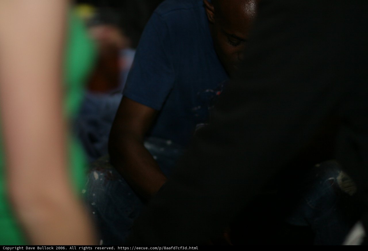 Man in Green Shirt Takes a Seat