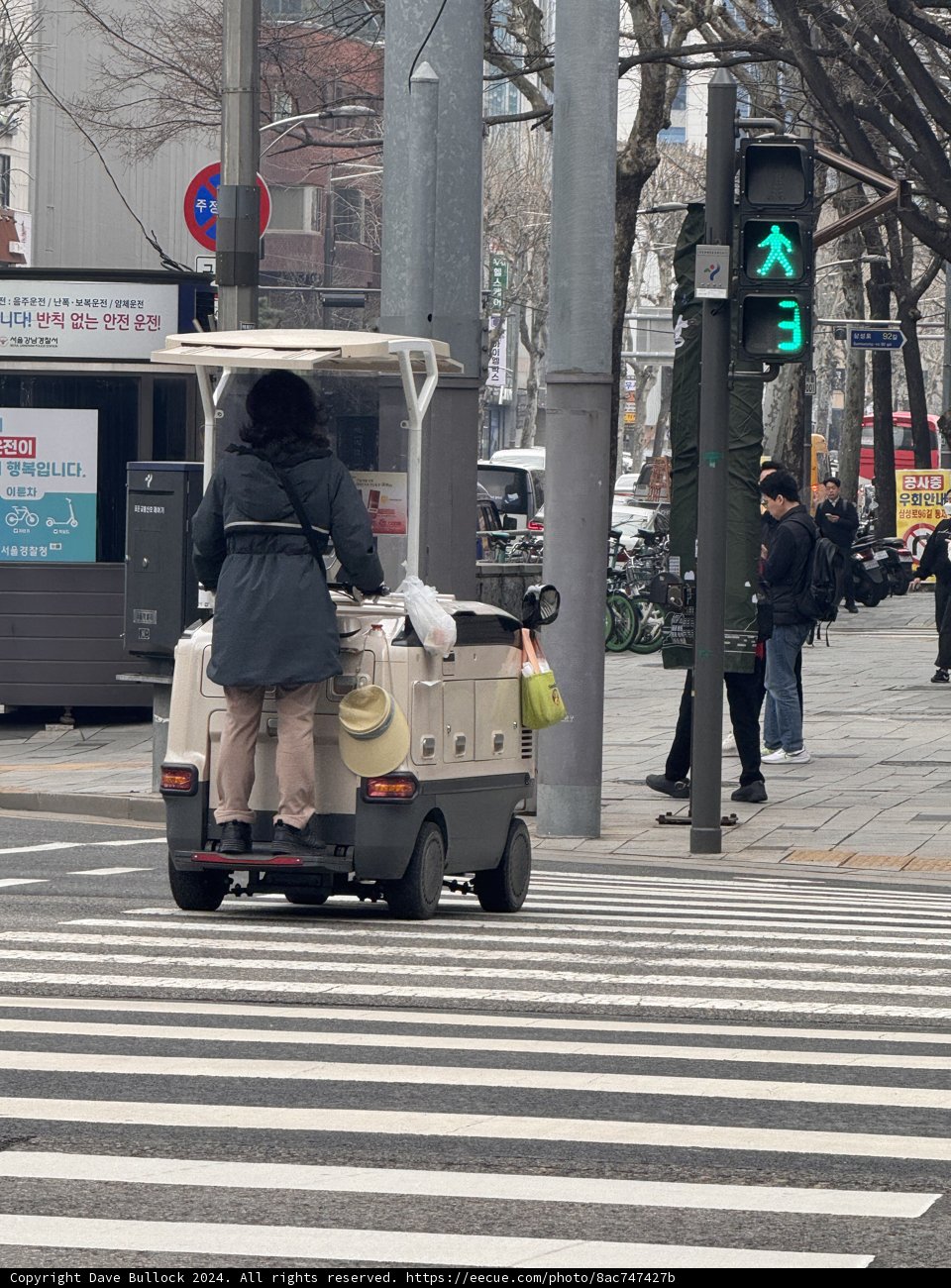 Urbane Encounters: Man with Cart in Seoul
