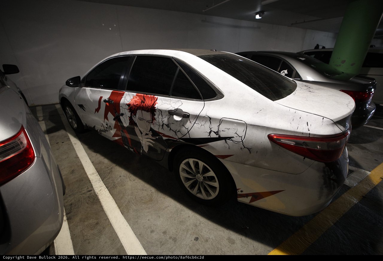 Anime-Wrapped Sports Car in Underground Parking Garage