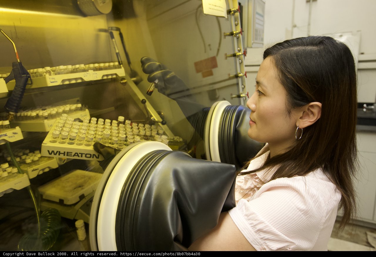 Woman in Lab Analyzing Machine
