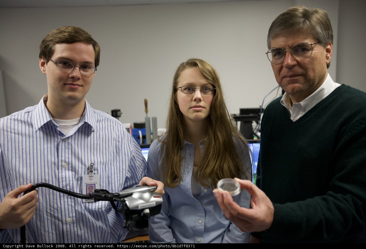 Three Individuals Posing for Camera in 2008 USC Eye Implants Album