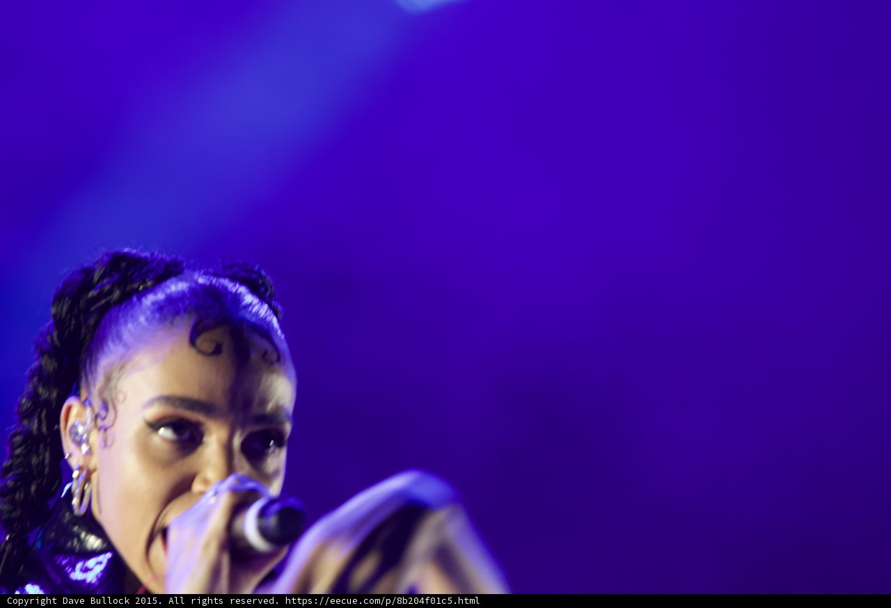 FKA twigs Soft Close-Up Portrait Baby Hairs Swirls Cat-Eye Makeup Hoop Earrings Braided Ponytails Rings Purple Blue Lighting Atmospheric