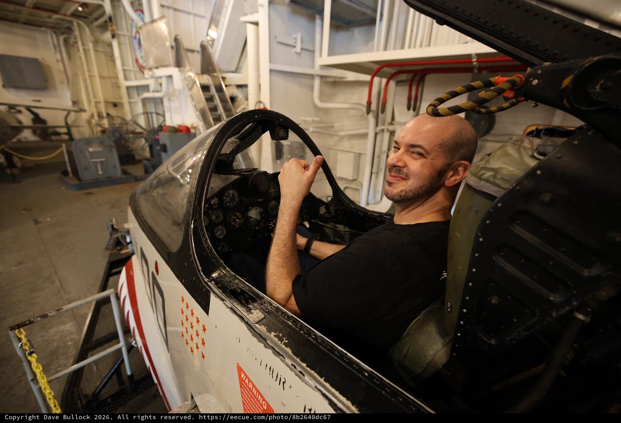Aircraft Mechanic Restoring Vintage Military Fighter Cockpit
