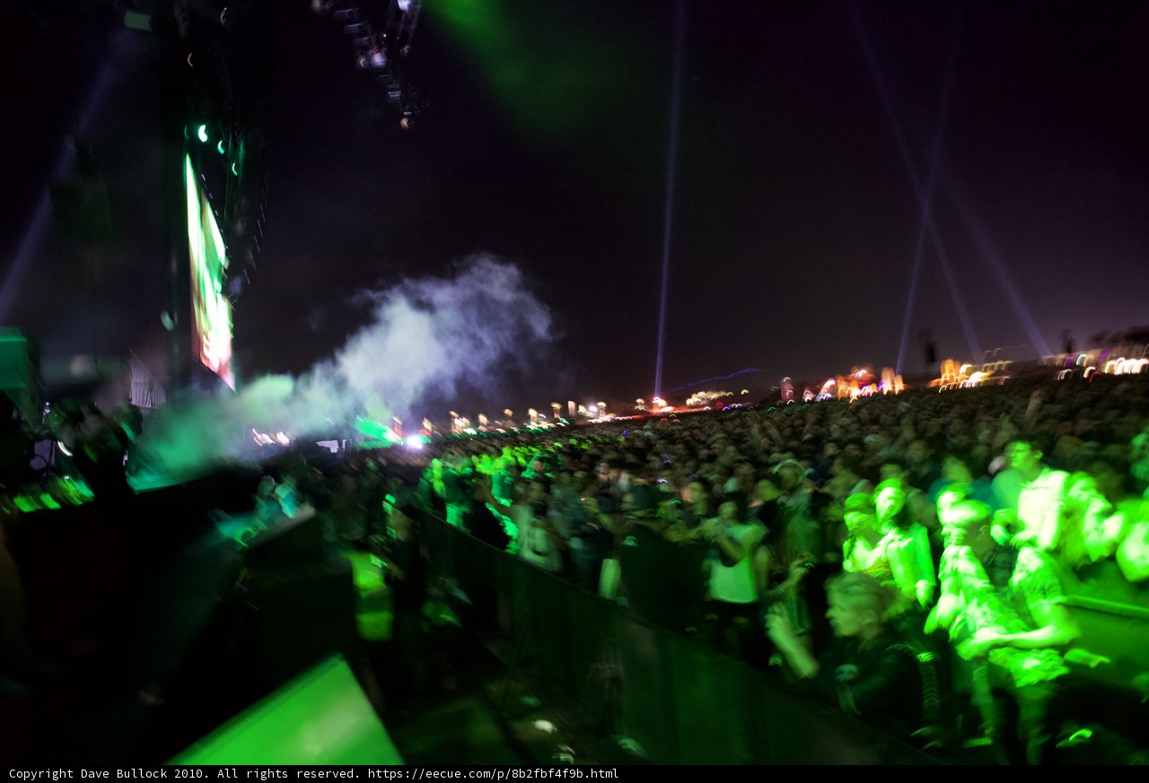 Green Lights Illuminating the Concert Crowd