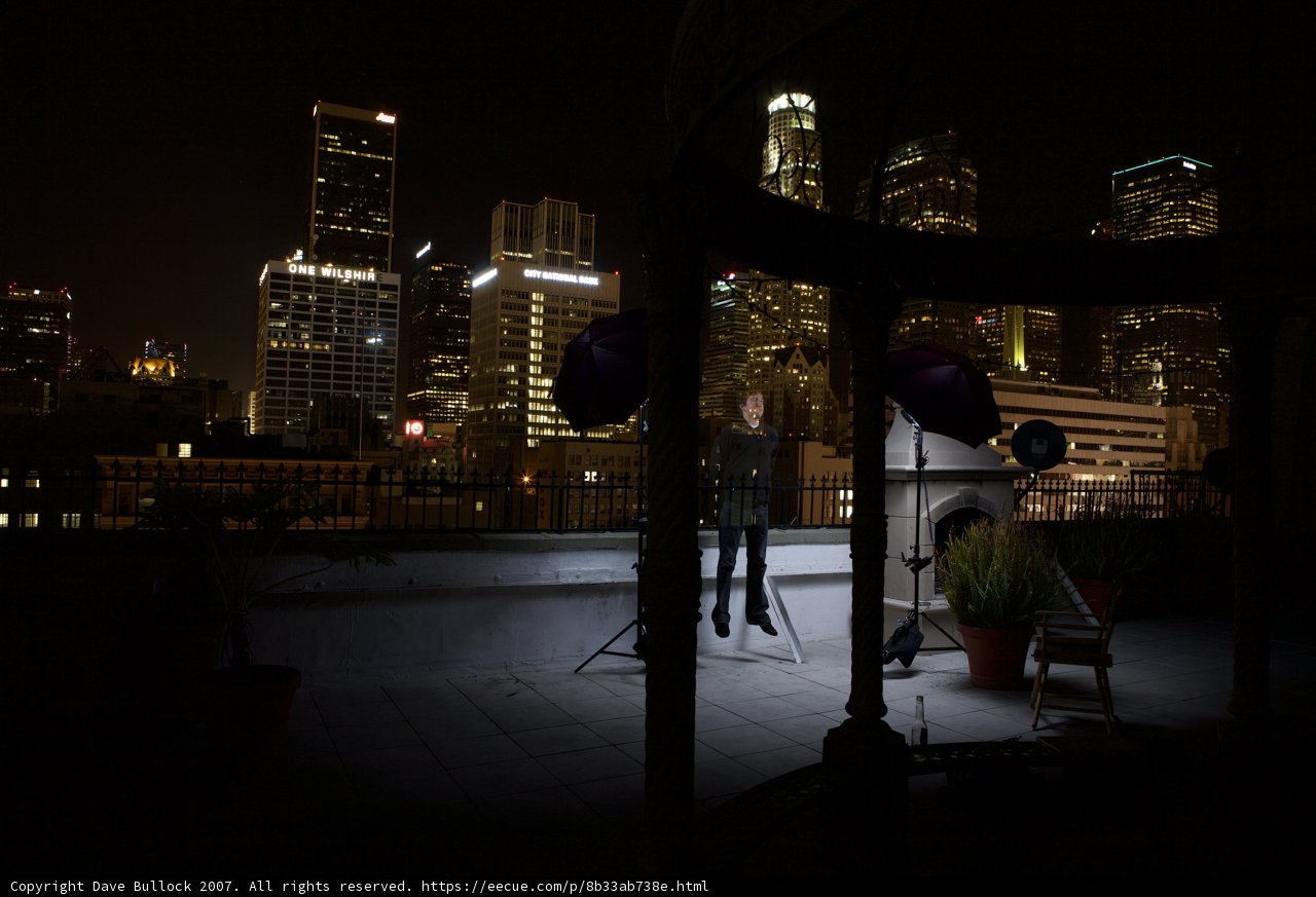 Urban Night Skyline with Chair and Decorative Plant