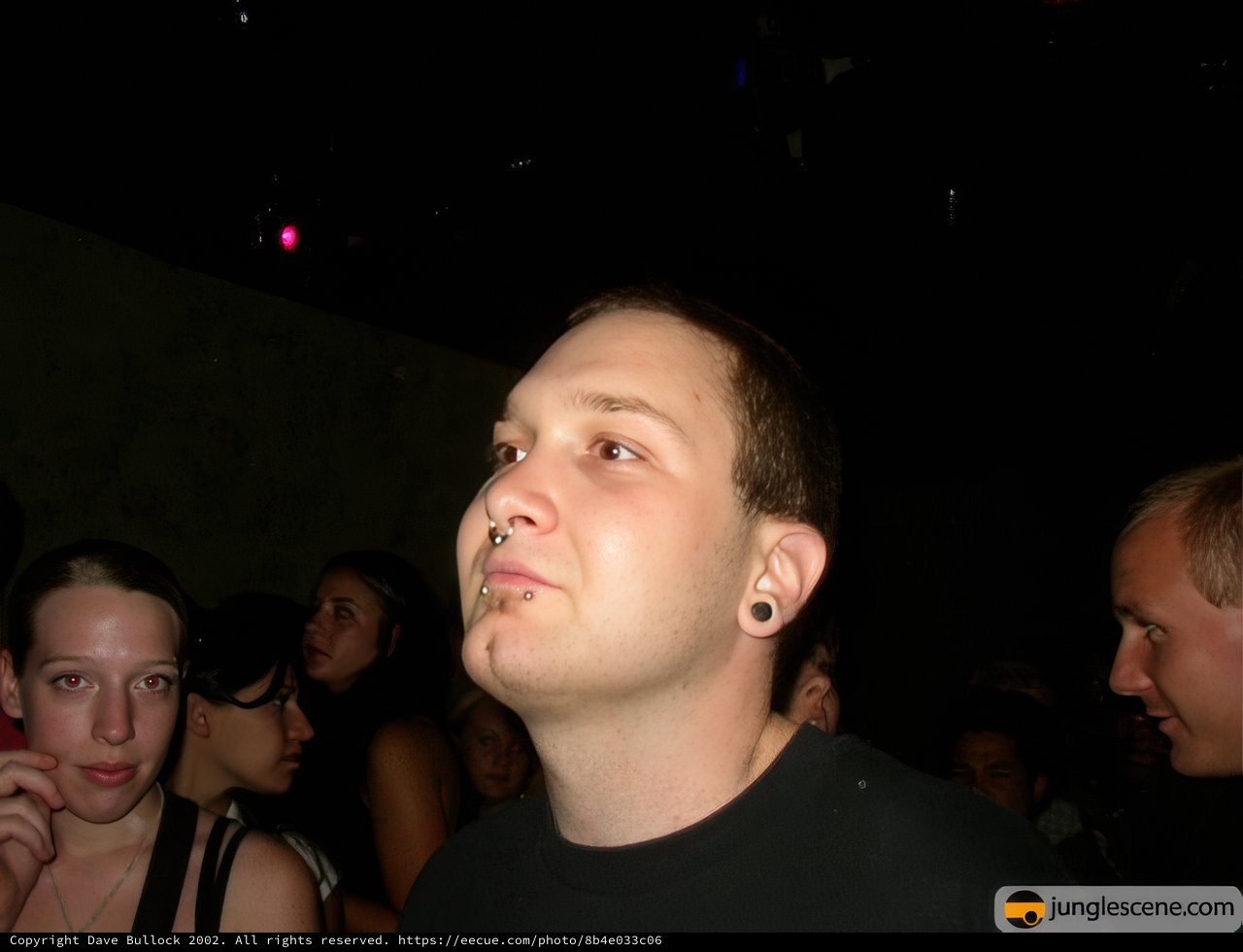 Urban Portrait: Pierced Man in the Night Club Crowd