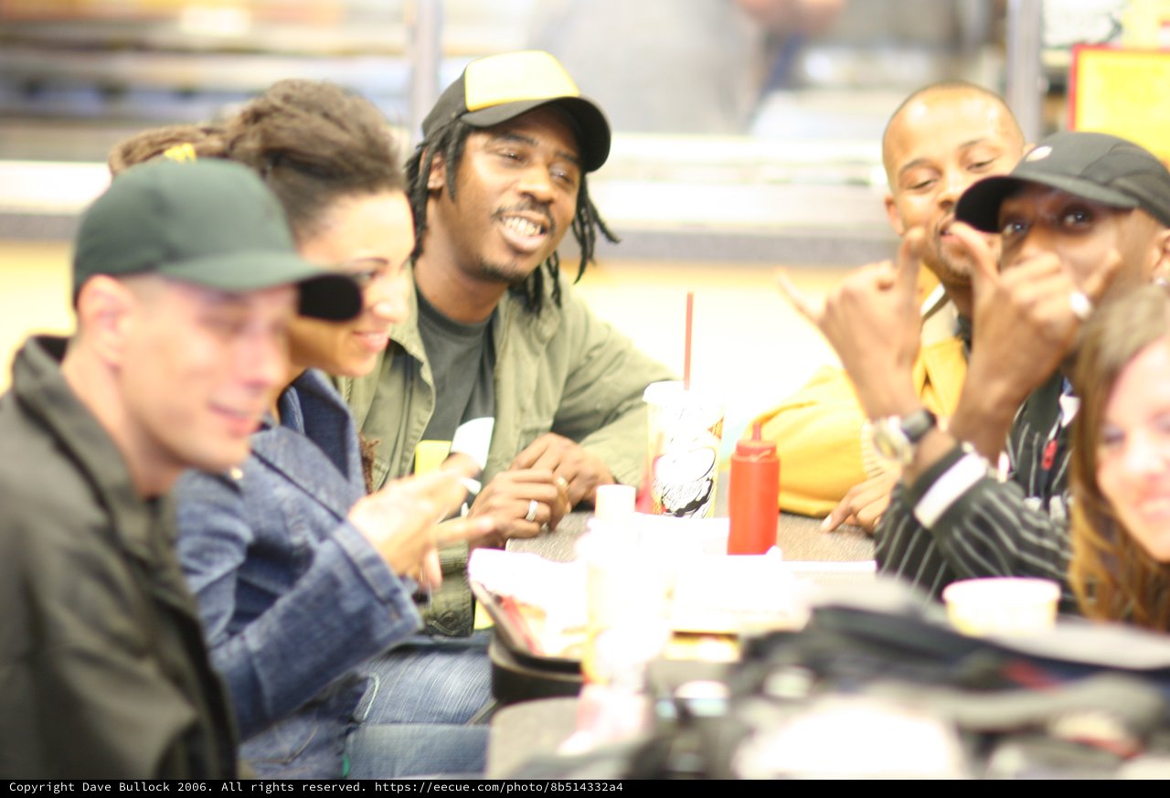 Friends Laughing Together at Fast Food Restaurant