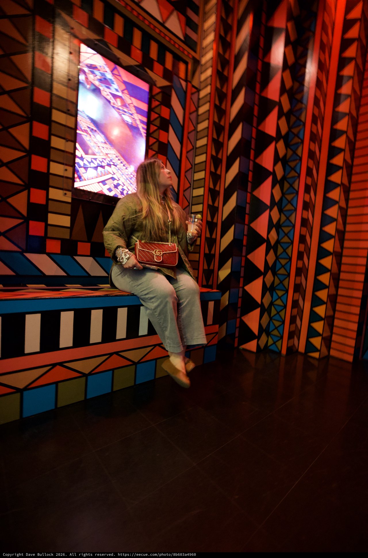 Woman in Colorful Geometric Art Installation