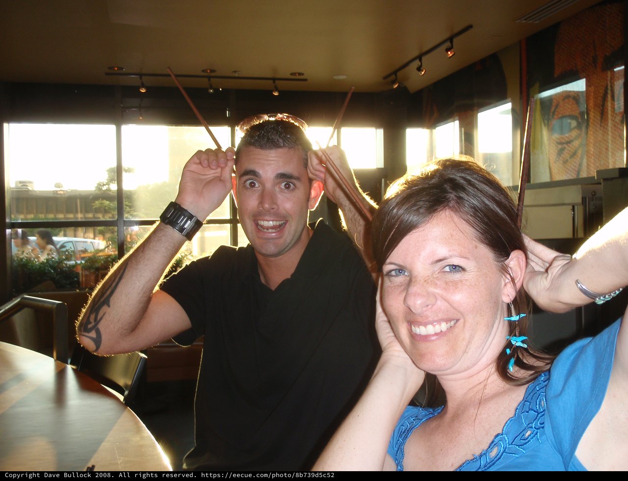 Friends Making Silly Faces at Restaurant Table