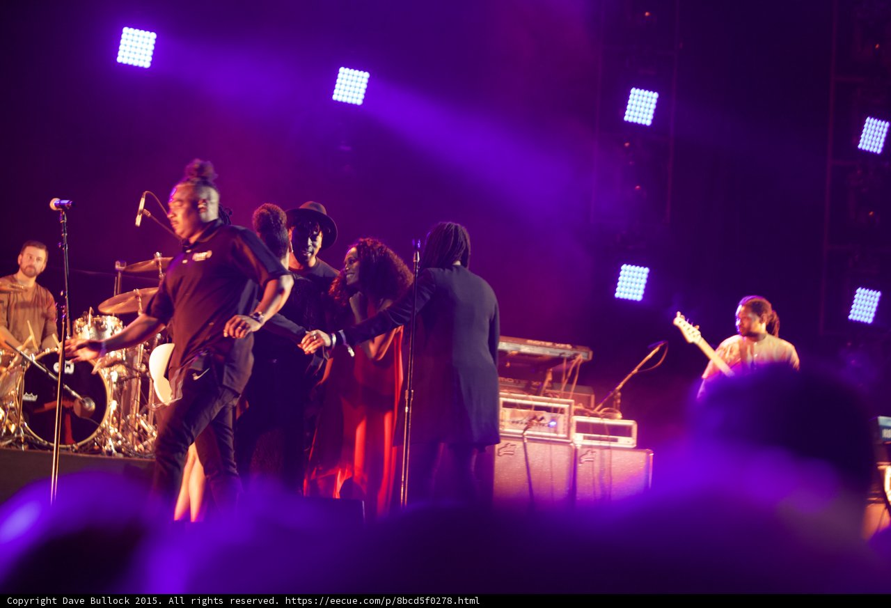 Solange Band Group Hug End Of Set Red Dress LED Panels Drummer Guitarist Purple