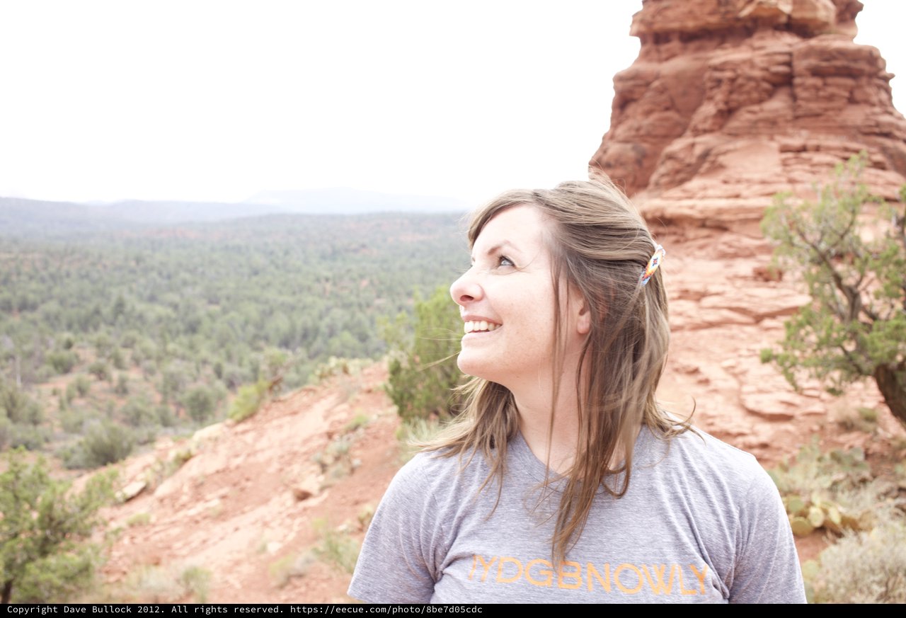 Woman Gazing Up at Sedona Red Rock Formation