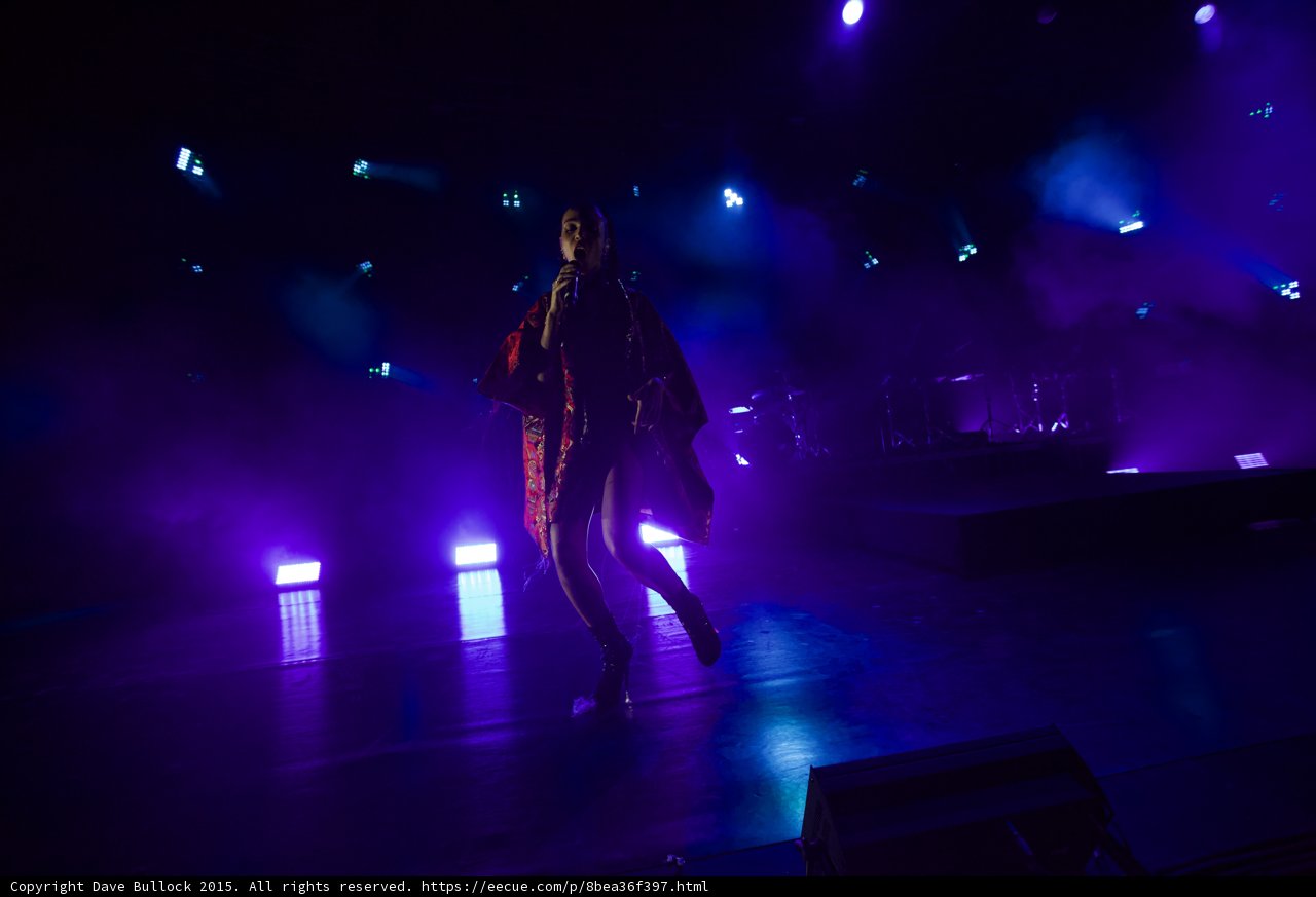 FKA twigs Dynamic Full Body Striding Legs Crossed Kimono Flowing Both Sides Red Brocade Interior Black Boots Blue Purple Lighting LED Panels