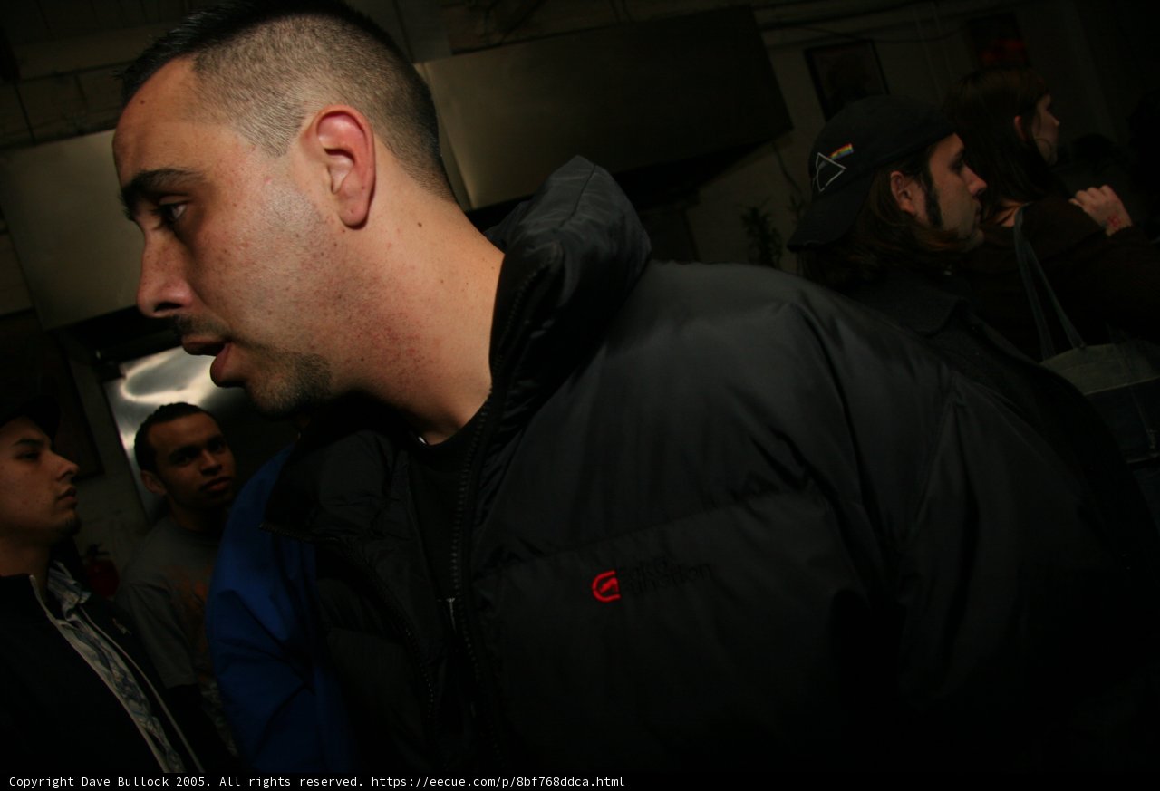 Man in Black Jacket at a Pub
