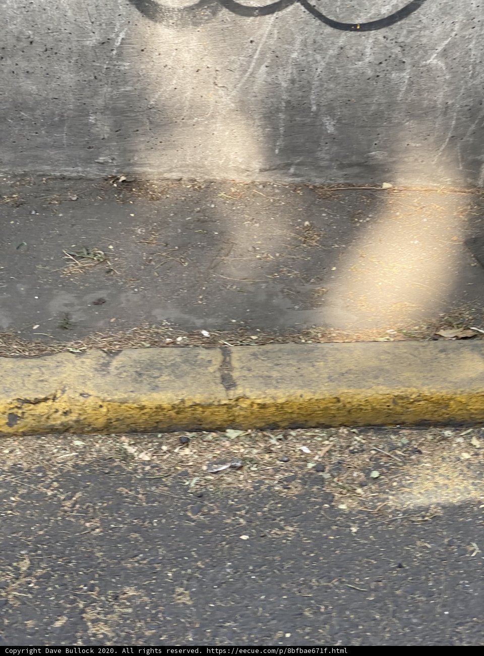 Yellow Line along Urban Wall