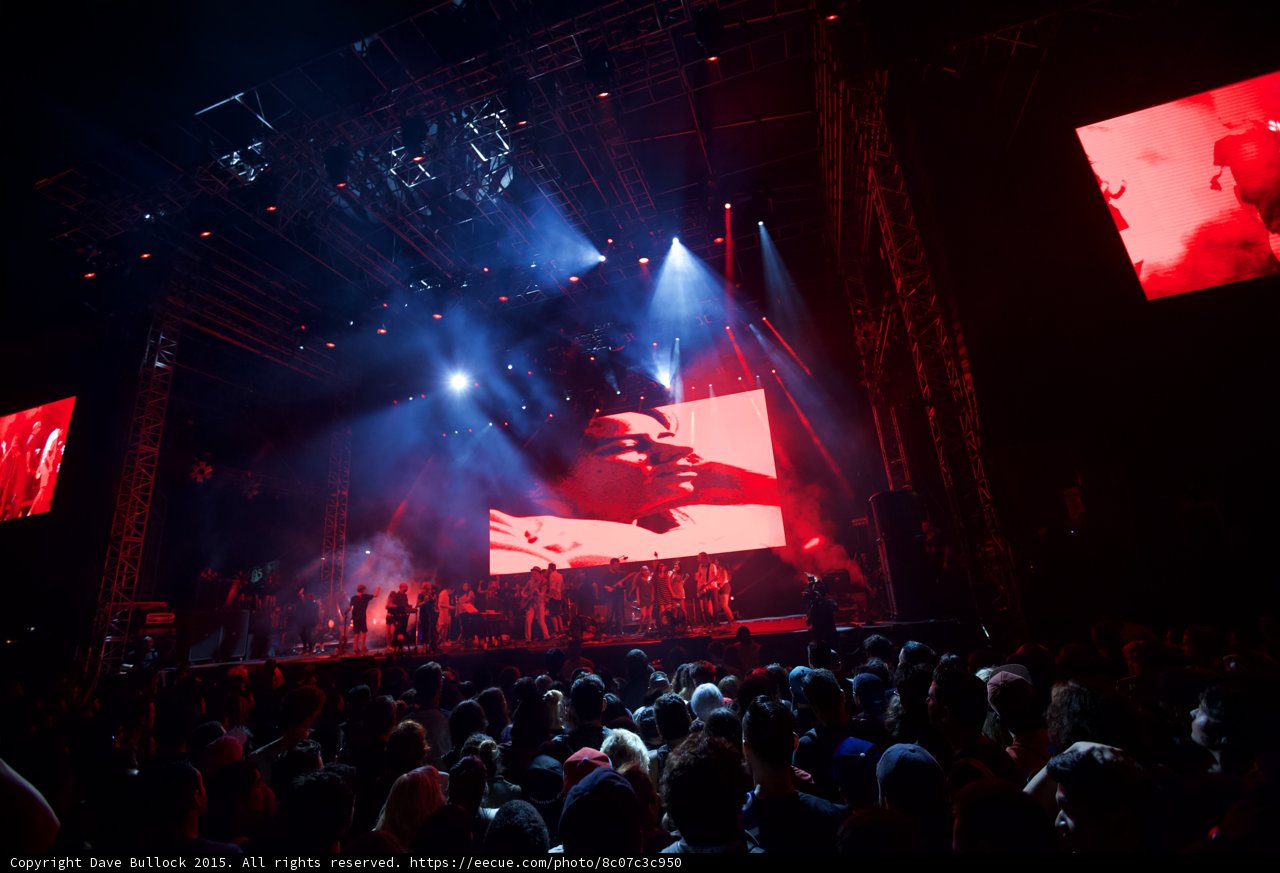 Belle and Sebastian Wide Stage Fans Video Screen Profile Portrait Red Lighting Spotlight Crowd