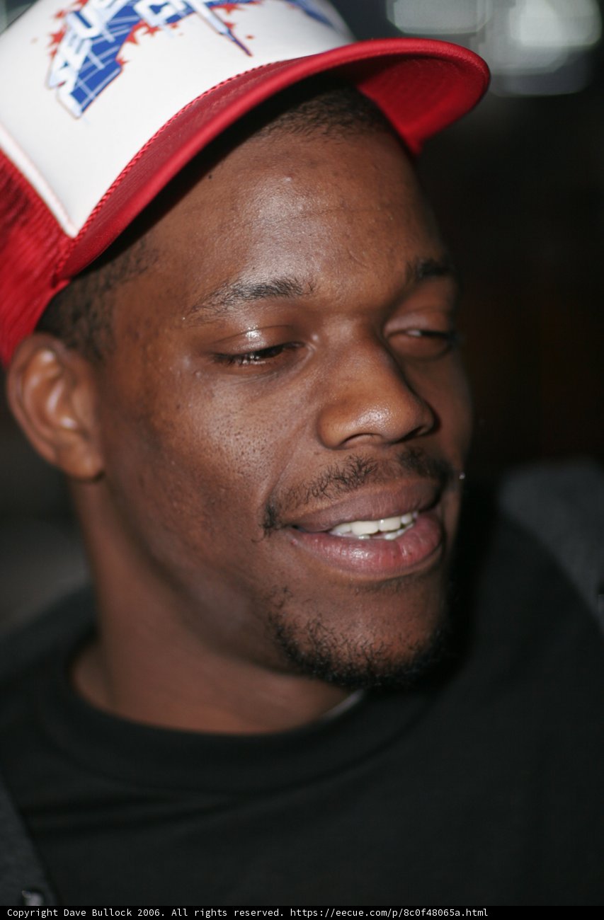 Smiling Man in Baseball Cap