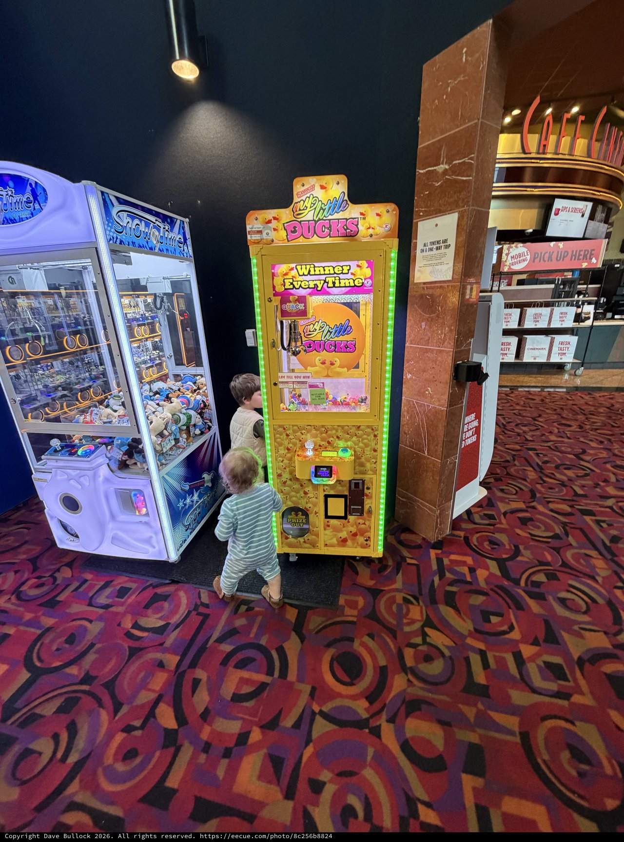 Children Playing Arcade Games at Movie Theater Lobby