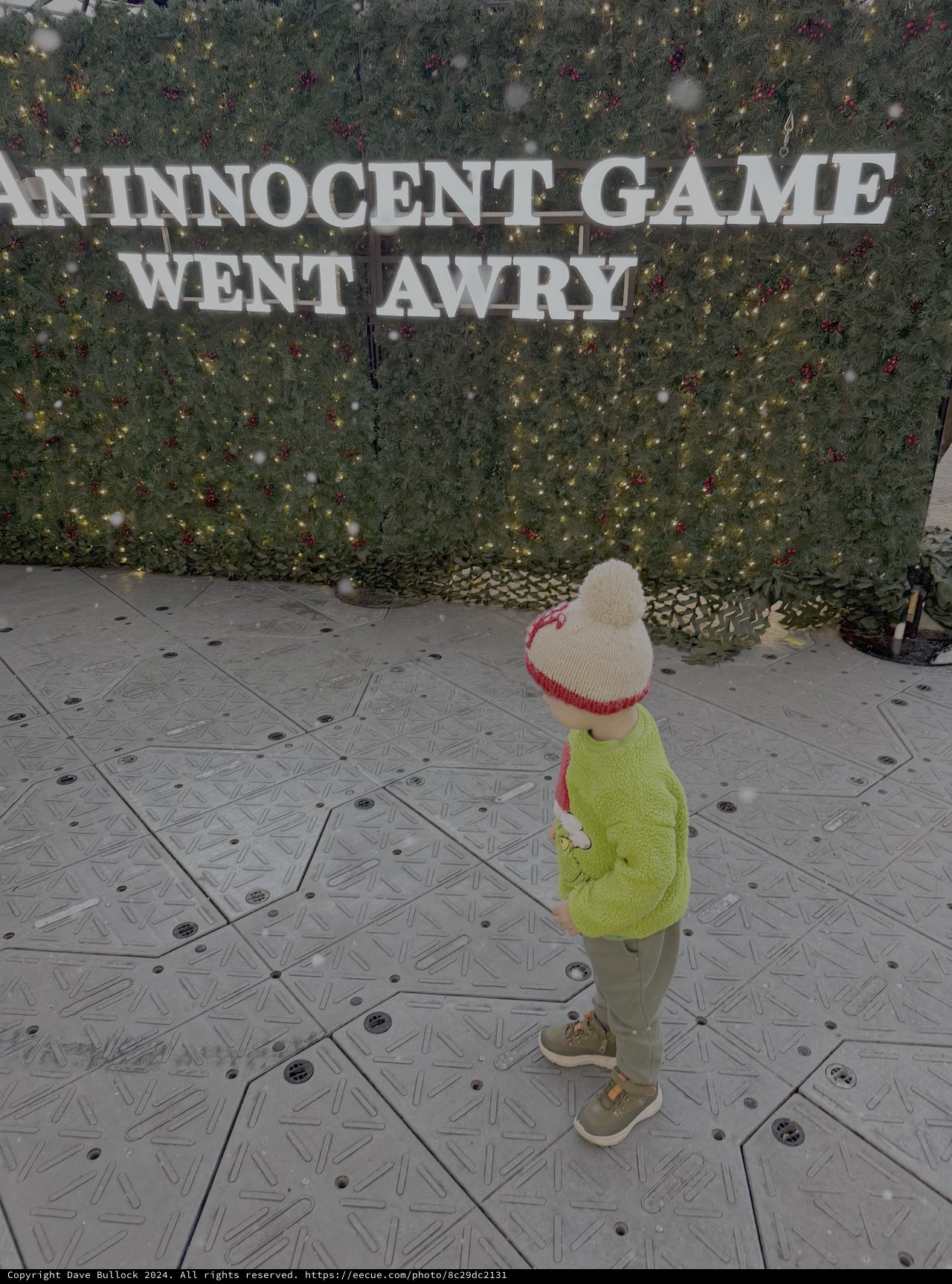 Child Playing in Snowy Holiday Display