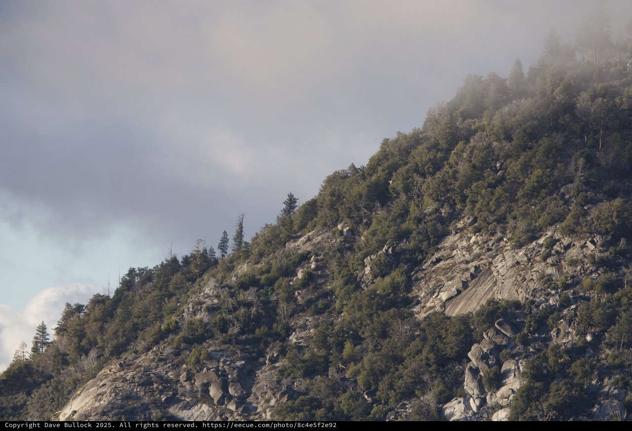 Misty Rocky Mountain Slope in Winter