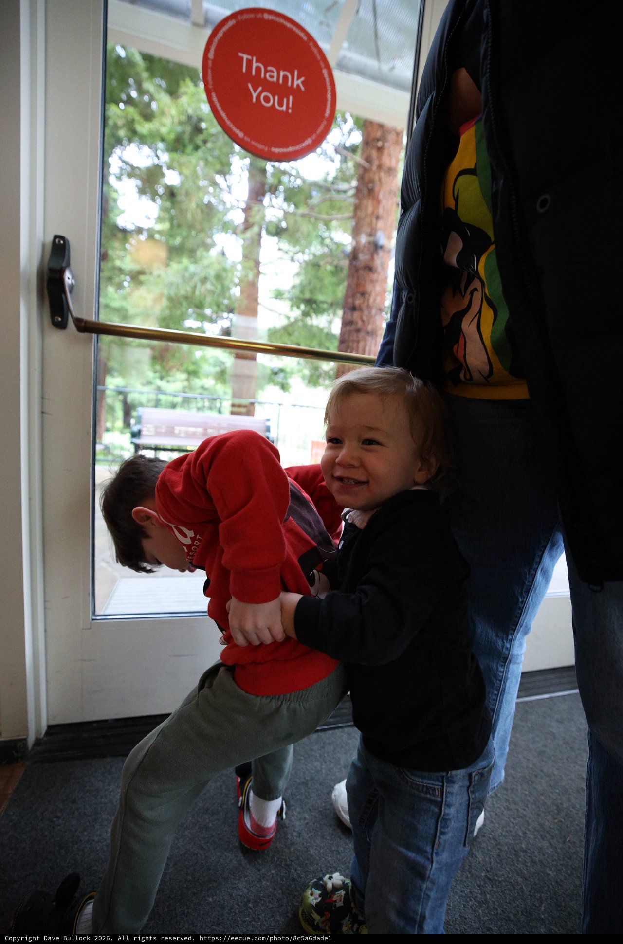 Young Children Pushing Door Together at Skywalker Ranch