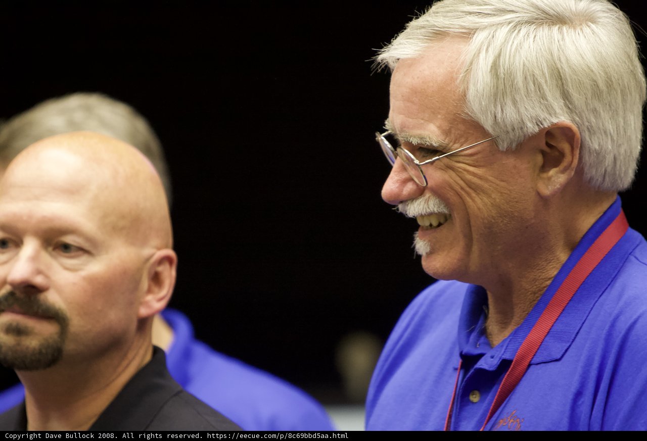 Smiling Senior Men in Blue Shirts