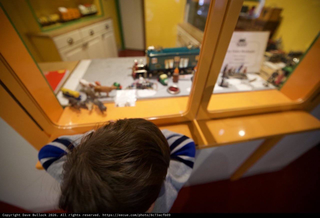 Child Exploring Museum Display from Above