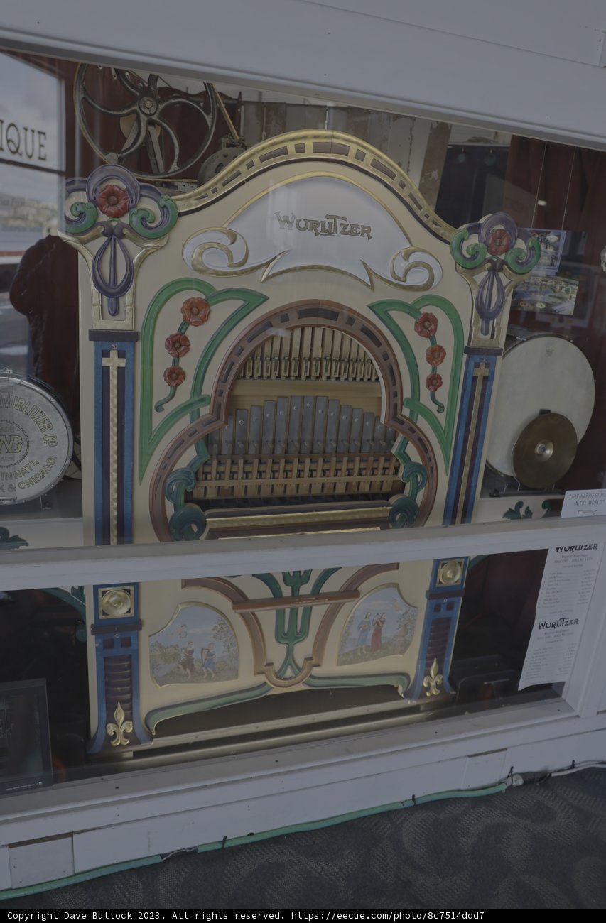 Grand Antique Organ Displayed in Glass Case