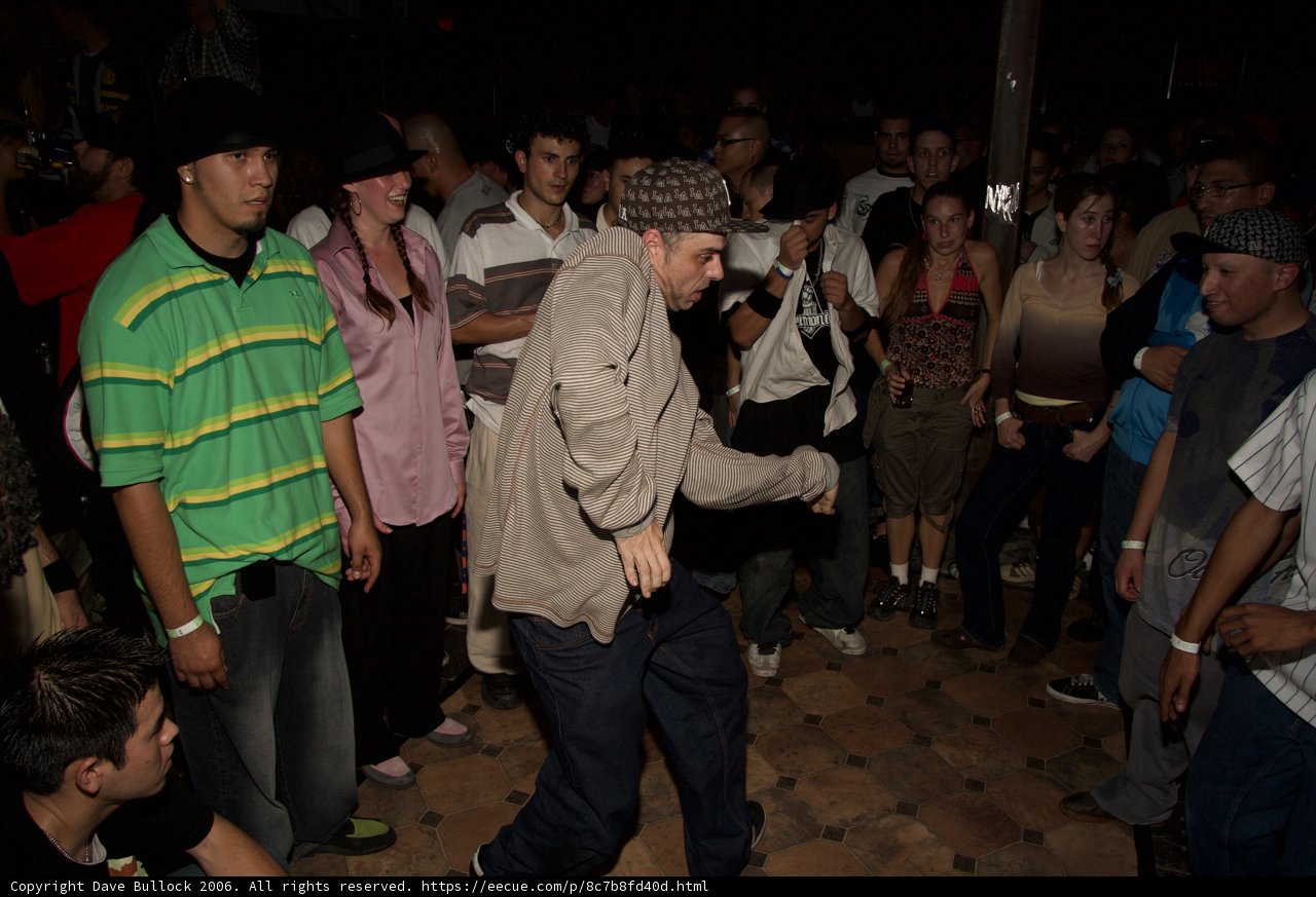Man in Green Shirt at Night Club