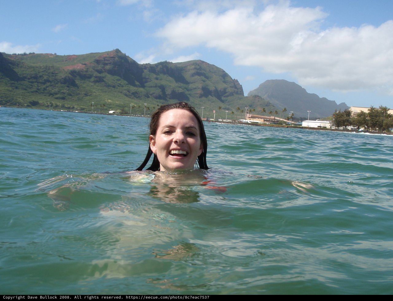 Joyful Ocean Swim with Hawaiian Mountain Backdrop