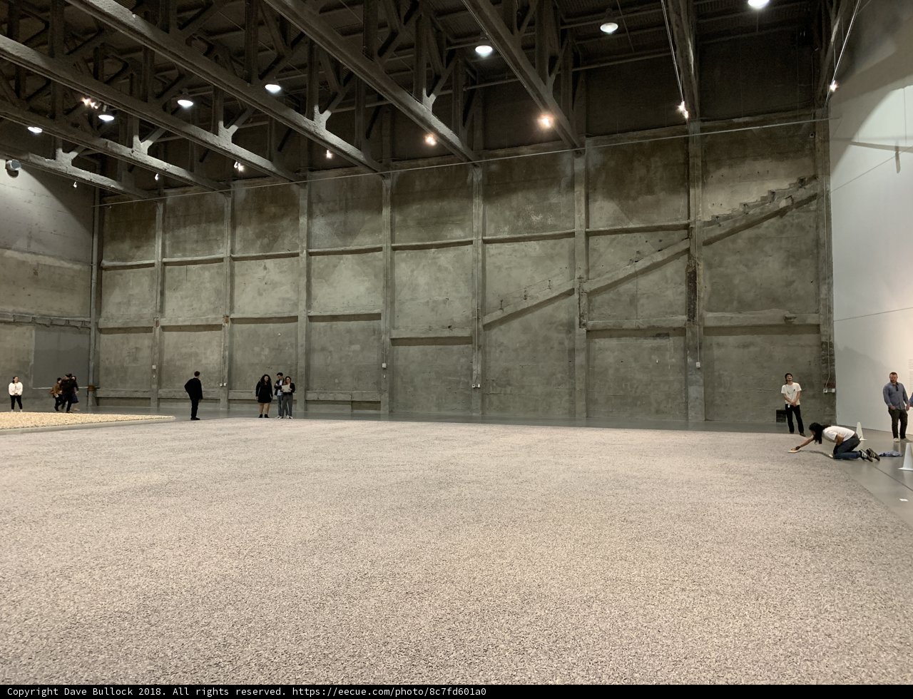People in a Hangar-like Building