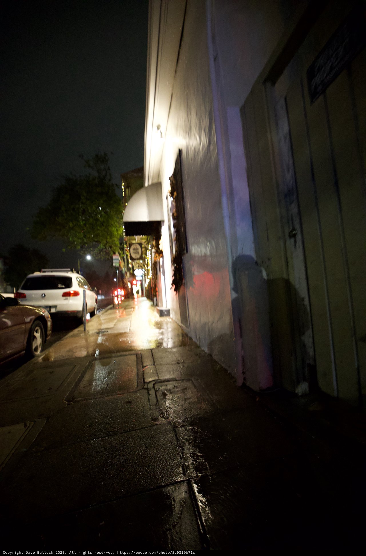 Wet Urban Sidewalk on a Misty Night