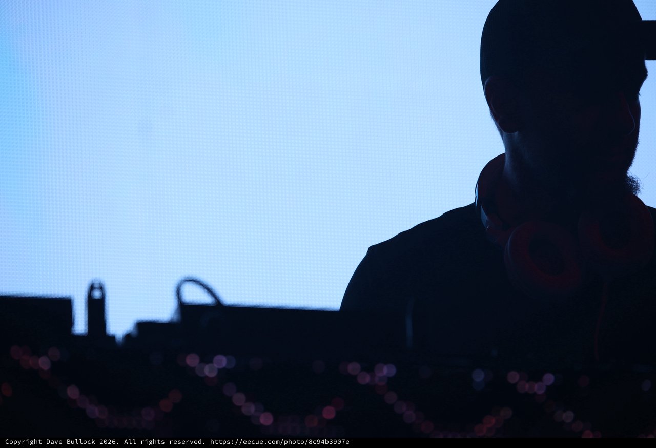 DJ Silhouette Against Blue LED Screen at Wobbleland