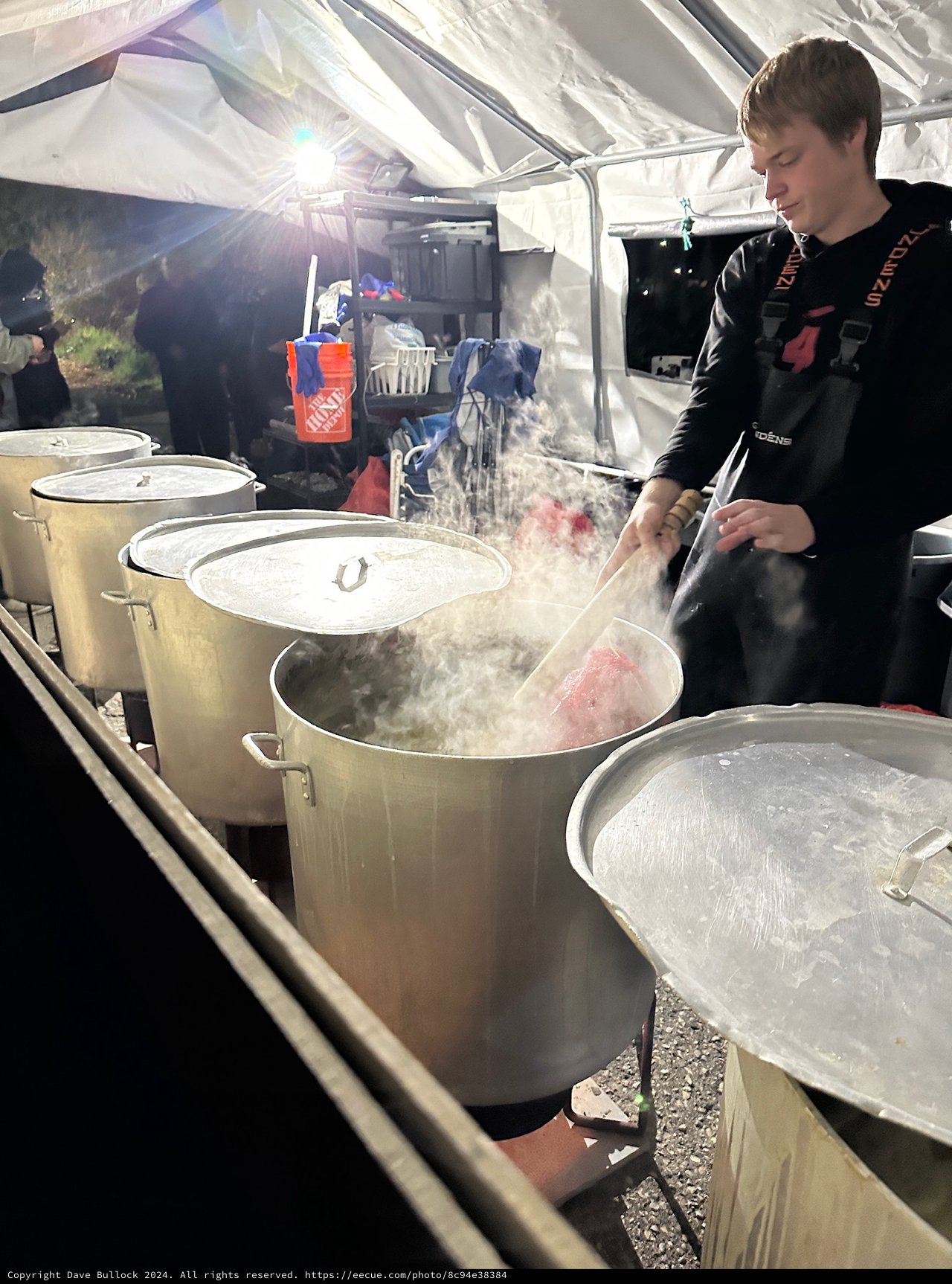 Chef Cooking in Large Steaming Pots Outdoors