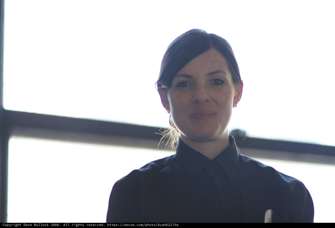 Backlit Portrait of Woman Against Bright Window