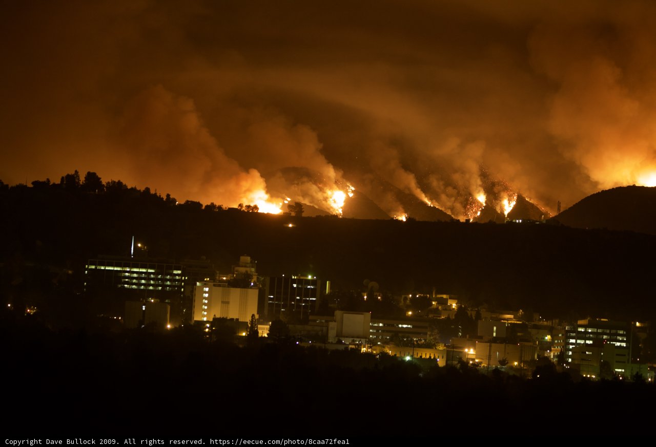 Flames Engulfing the Hills Above the City