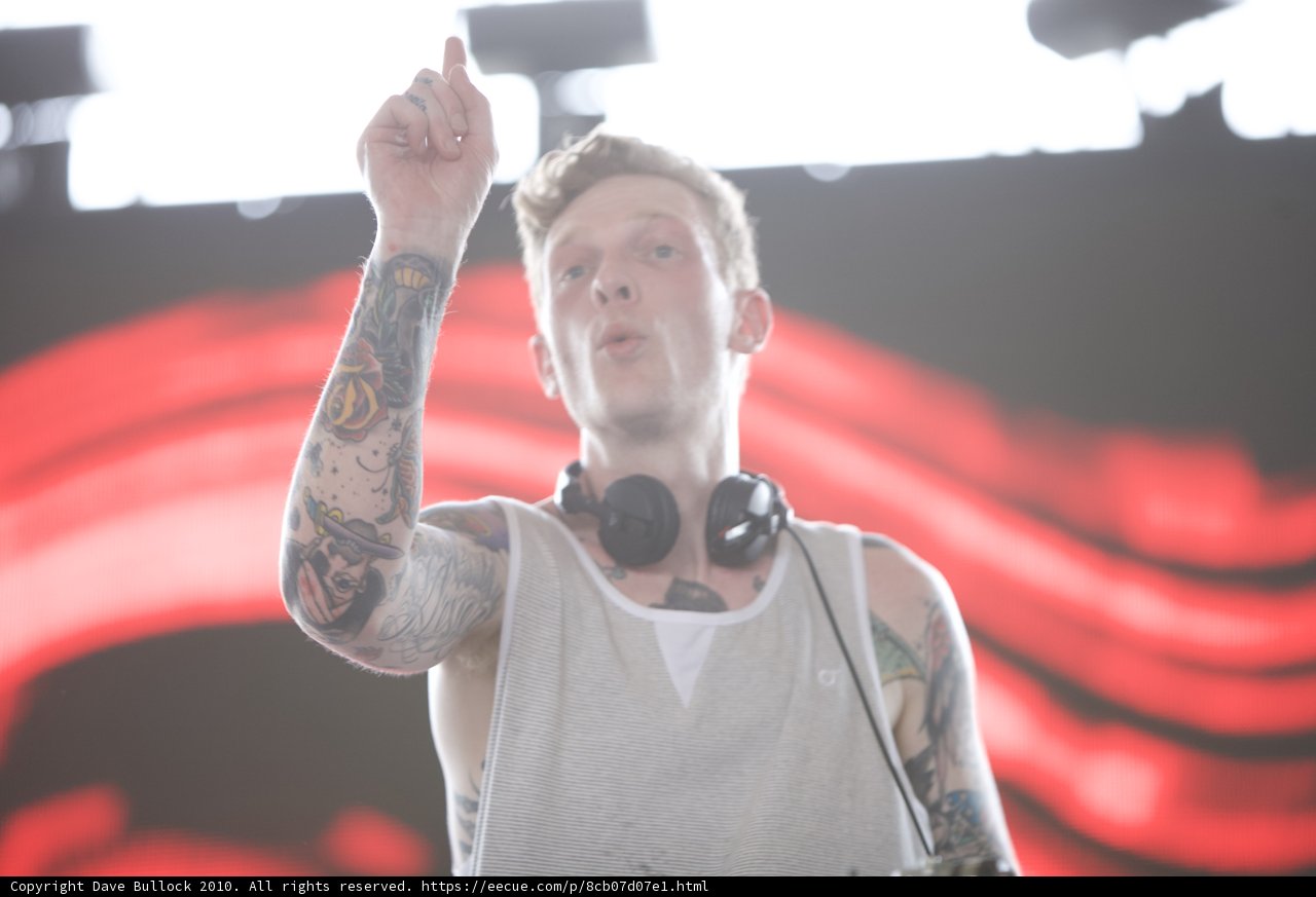 Tattooed Man Points His Finger in Coachella Crowd